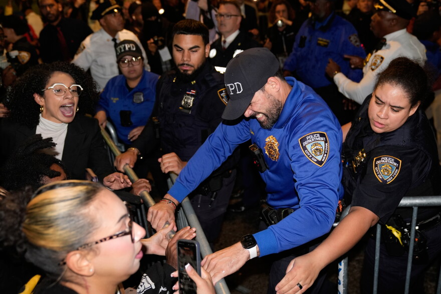 Protestors scuffle with police near at the scene of a shooting on Thursday, Oct. 8, 2026, in New York.