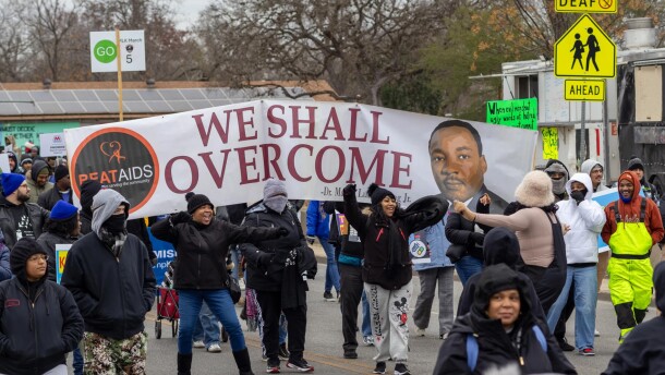 San Antonio organization Beat Aids is filled with exhilaration as music roars from the large speakers across the street during the 2025 MLK March in San Antonio.