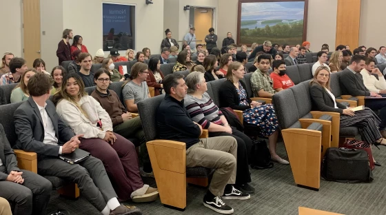 A crowd fills the seats of the Normal Town Council chambers, in Uptown Station.