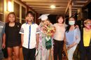 Keeana Villamar, dressed in Maui Preparatory Academy graduation regalia, with her family in 2021.