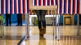 A University of New Hampshire student votes at the polls at Oyster River High School in Durham, N.H., during the first-in-the-nation primary. (Jesse Costa/WBUR)