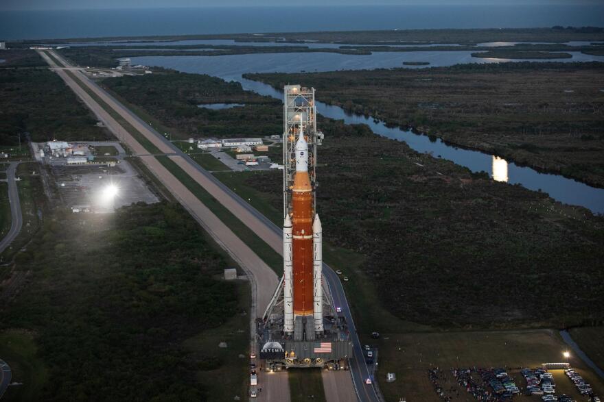 SLS rocket travels to launch pad on crawler-transporter.