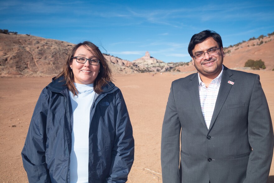 Kirby Morris, Diné, stands in the Red Rock State Park in Church Rock, New Mexico, on Feb. 27, 2022, with Dr. Abhishek RoyChowdhury, right, an assistant professor of environmental science at Navajo Technical University. Morris is studying mine reclamation under a program operated by RoyChodhury, and hopes to be able to use her knowledge with uranium cleanup.