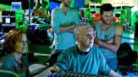 Writer-director James Cameron on the set of 2009's <em>Avatar</em> with cast members Sigourney Weaver, Joel David Moore, and Sam Worthington.