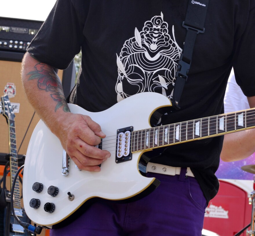Closeup of a guitar player at 2021 Valley Vibes.