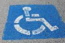 A handicap parking sign on a parking space