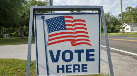 A sign directing people to a Jacksonville voting precinct is pictured.