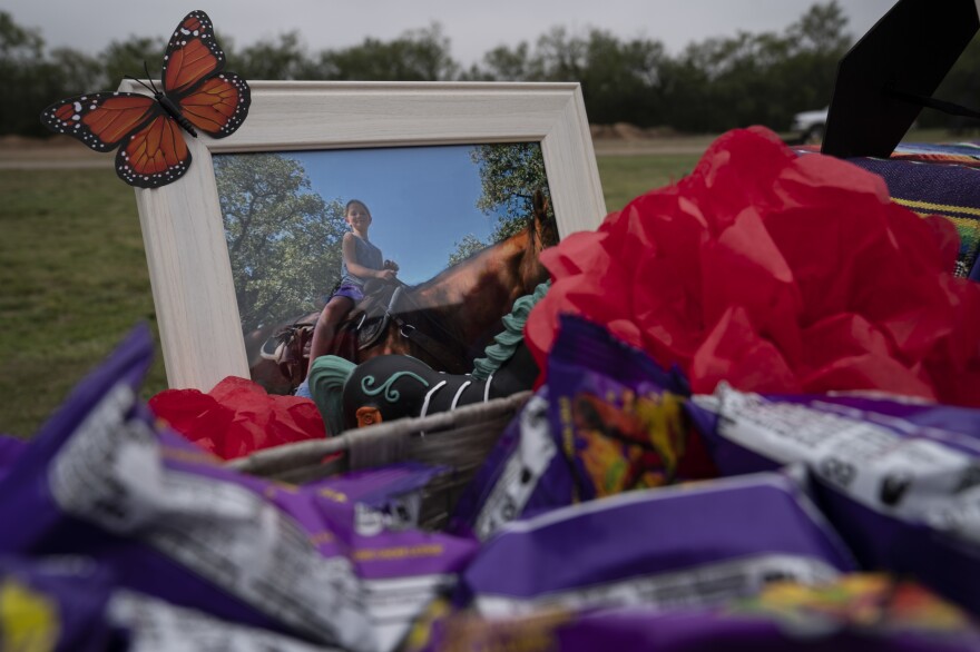 Makenna Lee Elrod's photo of her in a horse at her altar.