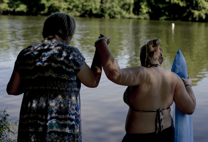 Alicia Forbit and her sister-in-law Madison take a swim in the river after visiting her Chris, Alicia's husband, in prison. "We make memories that he will never be part of because we can't stop living and having fun while he is in prison." Alicia said.