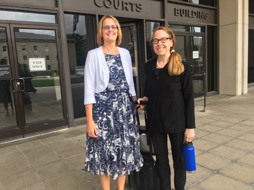 Andrea Barr, left, stands with her attorney Kathleen Cahill outside the Baltimore County Circuit Court.