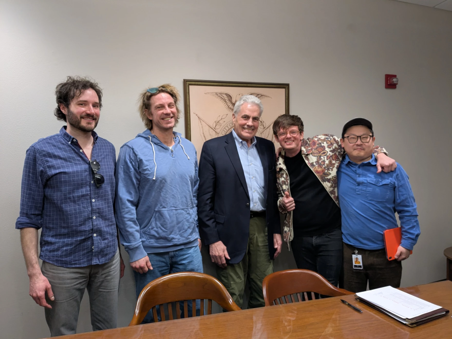 Milwaukee Area Service and Hospitality Workers Organization representatives (left) and Discourse Coffee employees (right) met at Alderman Bob Bauman's (center) City Hall office to count union cards Friday. Discourse leadership voluntarily recognized the union at the meeting.