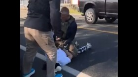 A still photo from a video captured by the woman's daughter as she was arrested by federal agents in October.