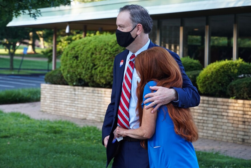 St. Louis County Executive Sam Page and his wife, Dr. Jennifer Page, walk away from their polling station at the First Church of Christ Scientist in Creve Coeur early Tuesday morning, Aug. 4, 2020. 
