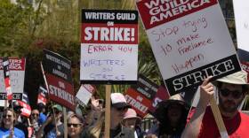 Members of the Writers Guild of America picket outside CBS Television City. (Damian Dovarganes/AP)
