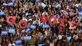 Rally-goers hold up letters to encourage people to go vote. President Obama urged millenials to go to the polls during his speech. "Young people, let me say this—you have the chance right now to reject mean-spirited politics that takes us back. You have the chance to shape history. Don't let that chance slip away," Obama said. (Rachel Wang/WUFT News)