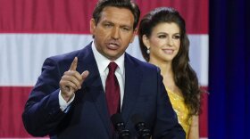 Incumbent Florida Republican Gov. Ron DeSantis speaks to supporters at an election night party after winning his race for reelection in Tampa, Fla., Tuesday, Nov. 8, 2022, as his wife Casey listens. 