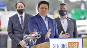Florida Gov. Ron DeSantis speaks the media at a coronavirus vaccination site at Lakewood Ranch Wednesday, Feb. 17, 2021, in Bradenton, Fla. (AP Photo/Chris O'Meara)