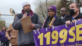 Workers of Buffalo Community Healthcare Center, represented by 1199SEIU, speak with the media Nov. 17 outside the Delaware Avenue nursing home after securing a new three-year contract. The union said New York's upcoming safe staffing law and profit cap helped the negotiations.