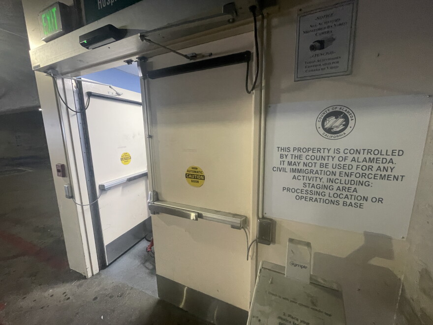 A sign in the parking garage at Highland Hospital notes Alameda County's ICE-Free Zones policy.