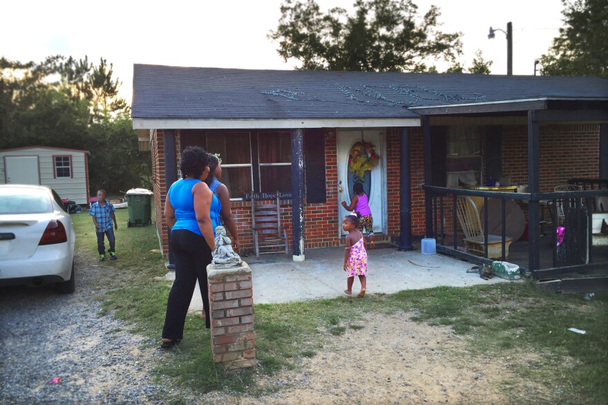 Ethel Johnson and her daughter Clanlethia go into the Camden, Alabama home of one of the teens Ethel recruited for the study.