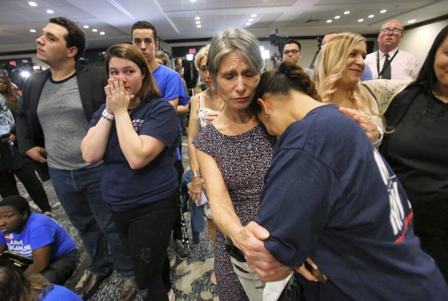 Erika Smith, second from right, consoles Gisela Alvarez, right, at the Nelson for U.S. Senate election night party, in downtown Orlando, Fla., Tuesday, Nov. 6, 2018, as supporters react to results in the election. Republican challenger Rick Scott claimed victory but Nelson is calling for a recount. (Joe Burbank/Orlando Sentinel)