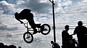 Pablo Forllan is silhouetted while doing a bike trick at the new skate park.