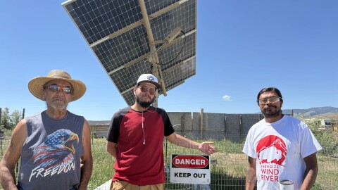 Western Shoshone elder Tommy LeBeau, left, Aaron Day, center, and Austin Hill stand next to the fully-operational solar installation at LeBeau’s place.
