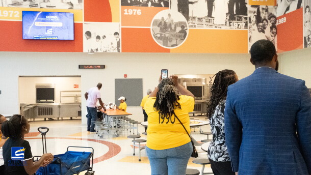 Alumni, staff and community members tour the new John F. Kennedy Middle School on July 31, 2026, in Suffolk, Virginia.