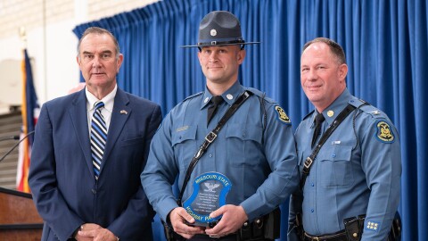 Keaton Siebenaler, center, receives the Colonel C.E. "Mel" Fisher Superintendent's Award from the Missouri State Highway Patrol, in this photo with Gov. Mike Kehoe, left, and MSHP Superintendent Col. Michael Turner, right.
