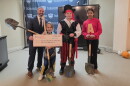 Dean Pettinato, director of the Scranton School for Deaf & Hard-of-Hearing Children, and some of the school's students pose for a photo during an event to mark the start of renovations for a wellness center.