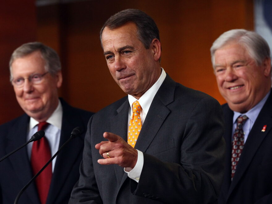 House Minority Leader John Boehner answers questions from reporters at the Capitol with Senate Minority Leader Mitch McConnell (left) and Mississippi Gov. Haley Barbour on Wednesday. Following Tuesday's midterms, Republicans stand ready to take control of the House of Representatives, with Boehner likely becoming the next speaker.