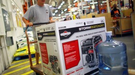 Home Depot has long offered credit cards, partly to serve customers who have just suffered major house damage. The company has recently widened those efforts. Here, a Tampa, Fla., customer buys a generator and bottled water, preparing for Tropical Storm Isaac's arrival in August.