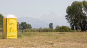 A porta-potty waits for eclipse campers at the rodeo grounds in Tetonia, Idaho. On Sunday afternoon, two tents were seen at the makeshift campground.