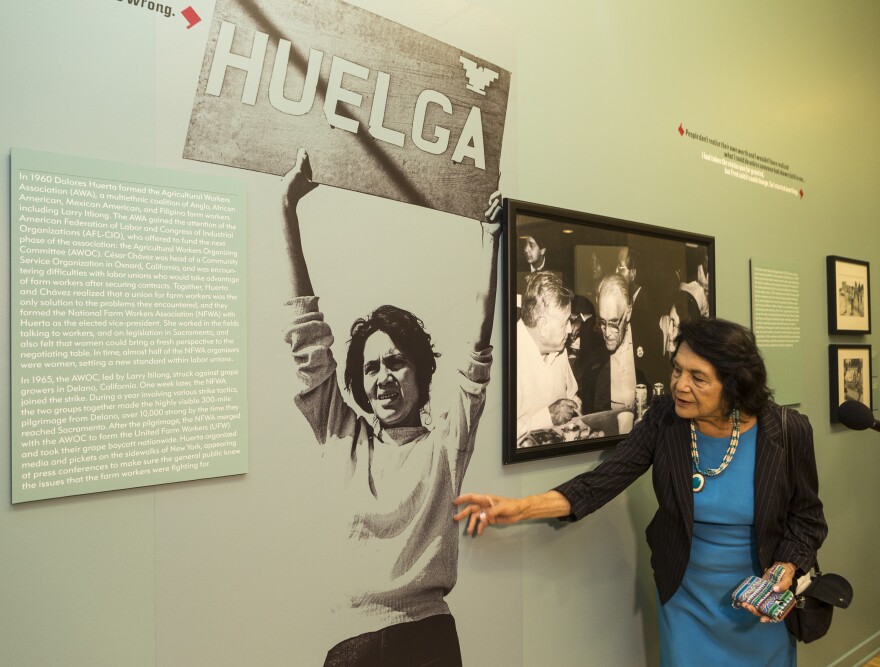 Dolores Huerta, co-founder of United Farms Workers looked at an iconic photograph of herself, as she toured her exhibition, "Viva la Causa! Dolores Huerta and the Struggle for Justice," at La Plaza de la Cultura y Artes museum downtown Los Angeles on Thursday, April 10, 2014.