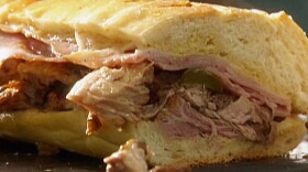 A proper Cuban sandwich has crisp Cuban bread, glazed ham, shredded pork, yellow mustard, a dill pickle, Swiss cheese, and despite what people in Miami say, Genoa salami.