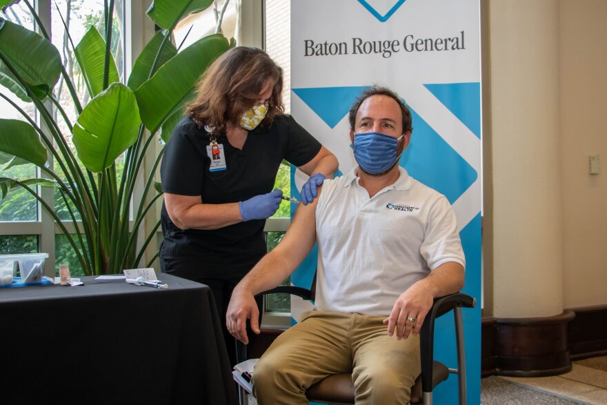  Dr. Joseph Kanter receives a flu shot and a booster dose of the COVID-19 vaccine on Oct. 6, 2021. 