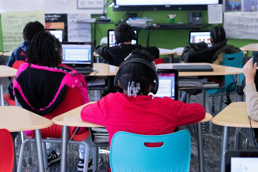 Second grade students at Tulsa Public Schools' John Burroughs Elementary work with the AI tutoring program, Amira.