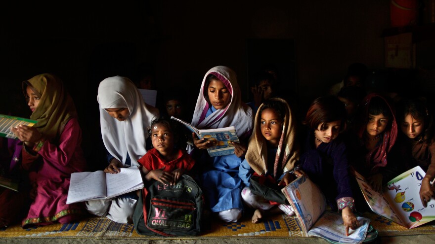 These Pakistani children go to a makeshift school in a clay house, located in a poor neighborhood on the outskirts of Islamabad.
