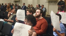 Activists protest Dayton's pedestrian safety ordinance at city commission meeting held May 23. 