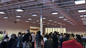 People in line waiting at an early voting site, Friday, Nov. 2, 2018. 