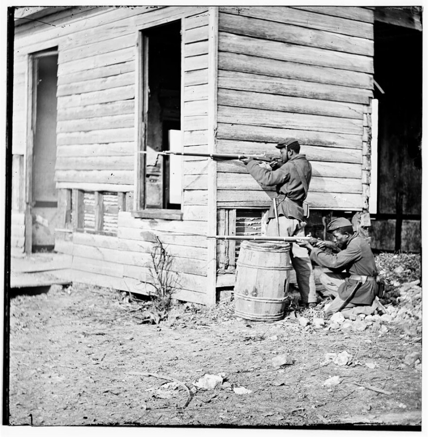 Two black soldiers man a forward watch station in Dutch Gap, Va., during the Civil War. Author Ta-Nehisi Coates says he has become a student of the war — and he's wondering why more black Americans don't join him.
