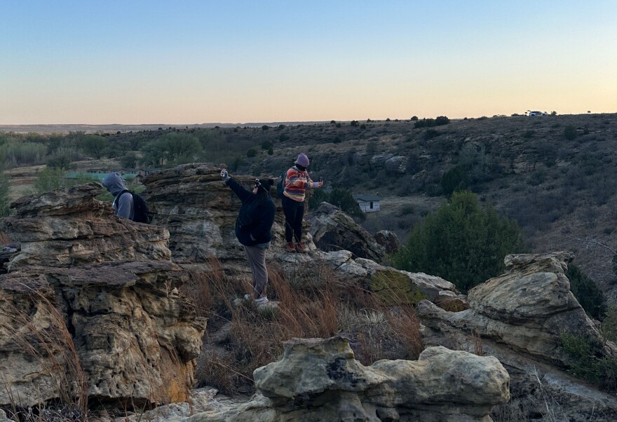 Kiker led a sunset hike of Black Mesa State Park's Rock Garden Trail on April 17, 2026. Visitors took photos of the sky, the landscape and themselves as dusk settled over the Panhandle.