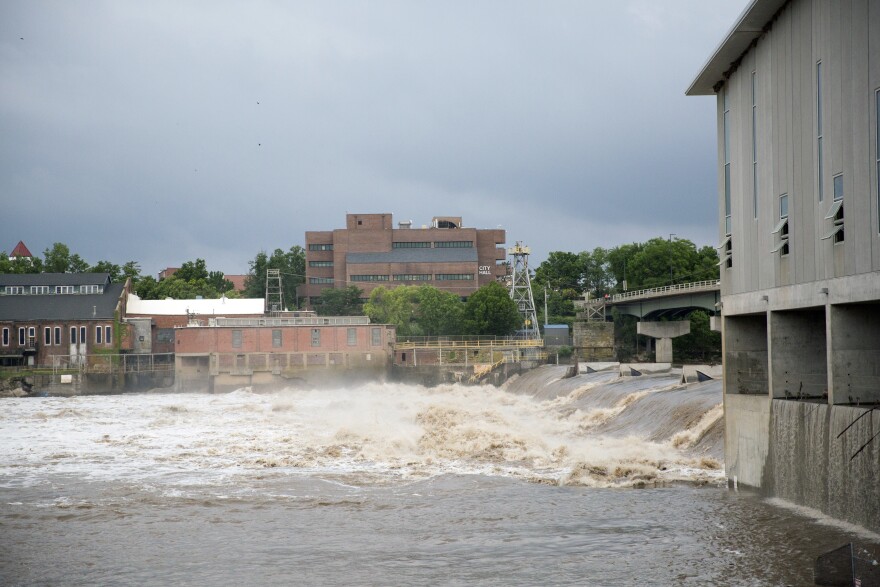 A photo shows the Kansas River in Lawrence.