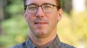 a portrait of a man outside