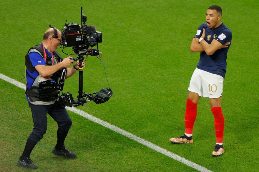 France forward Kylian Mbappé celebrates scoring his team's third goal during the 2022 World Cup round of 16 match between France and Poland on December 4, 2022.