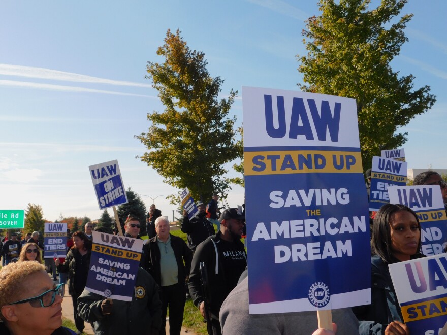 Members of the United Auto Workers union picket at a Stellantis assembly plant in Sterling Heights.