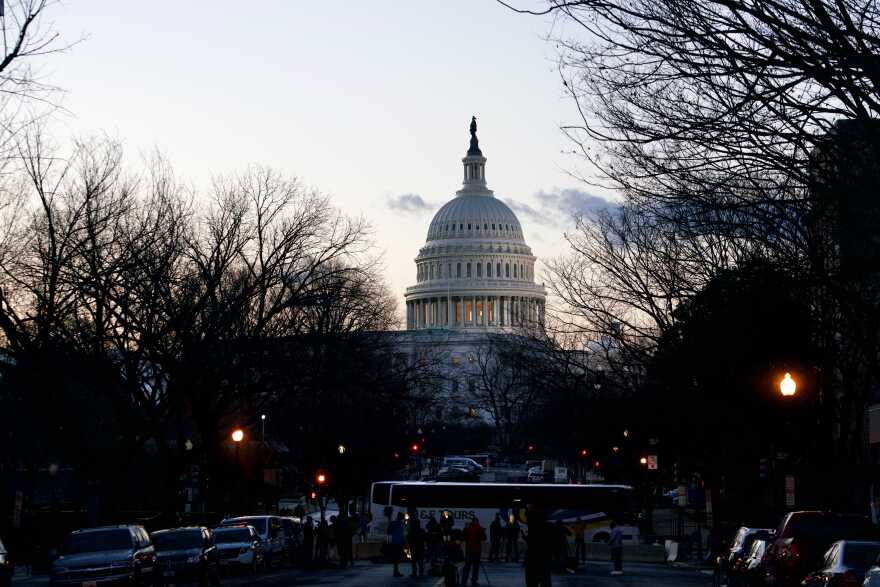 The U.S. Capitol is seen at sunrise on Wednesday, two weeks after it was stormed by a mob of pro-Trump extremists.