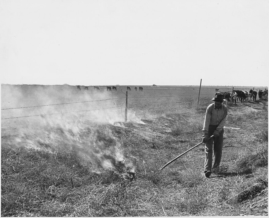 A man in Haskell County, Kansas burning tumbleweeds in the roadside ditches is a regular Spring practice.