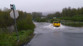 A lone truck braves the flooded road, June 9, 2024.