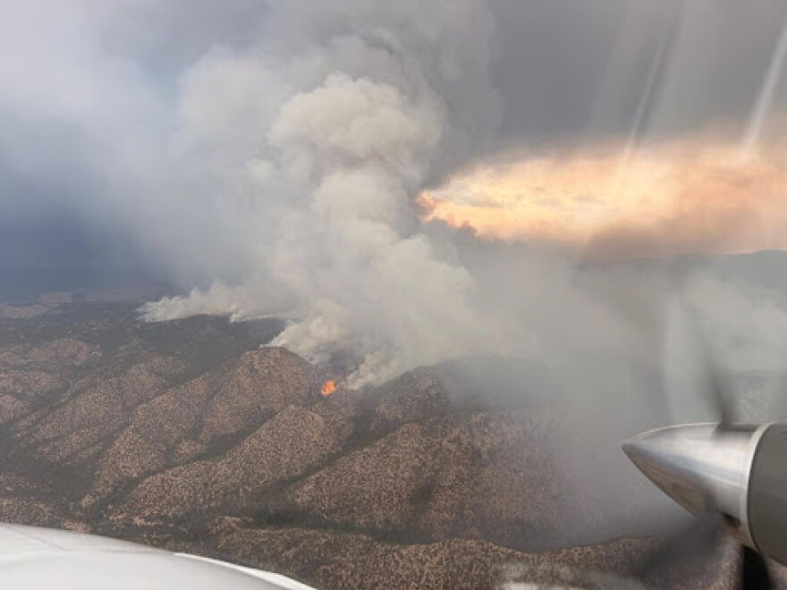 The Frijoles Fire is seen burning northeast of Santa Fe, New Mexico, on Monday, Aug. 10, 2026. The fire sparked on Aug. 4 and has grown to about 7,800 acres with just 1% containment as of Aug. 13.